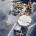 Boats are seen spraying water on an oil and gas platform that exploded in the Gulf of Mexico, of the...