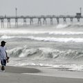 Almon Telling looks at the surf as he walks along the beach as Hurricane Earl heads toward the easte...