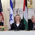 Israeli Prime Minister Benjamin Netanyahu, left, and Palestinian President Mahmoud Abbas, right, smi...