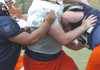 Rogers Heritage’s Reid Schatzman muscles his way through the War Eagles’ offensive line during practice on Tuesday in Rogers.