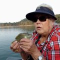Sallyann Brown says “thanks” to a green sunfish before releasing it. Brown caught the feisty sunfish...
