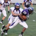 Fayetteville linebacker Ben Dubois tackles running back Deshunn Thomas on Aug. 23 in a scrimmage at ...