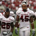 Arkansas tight end D.J. Williams, right, and cornerback Ramon Broadway both claim to have played a h...