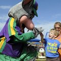 HIGH FIVE! - Kaden McGee, 2, gives a high five to Chuck E. Cheese at the Sunshine School on Thursday...