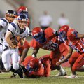 Rogers Heritage senior running back Zach Stewart, left, breaks away from Helena-West Helena Central ...