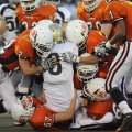 Springdale Southwest’s defense brings down Shiloh Christian’s Chandler Smith on Thursday in Bulldog ...