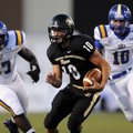 Bentonville quarterback Pearson Gean scrambles for a first down Friday during the first quarter of t...