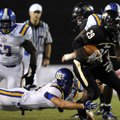 Bentonville running back Tearris Wallace shakes North Little Rock linebacker Zach Ketchum on a carry...