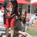 FRIST 'FRY-DAY' - Clay Airoso, 6, left, and Storm Airoso, 13, eat pizza and french fries in cool wea...