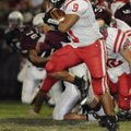 Farmington junior running back Jared Martin speeds past the Huntsville defense in the first half Fri...