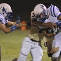 Rogers High wide receiver Graham Parker is tackled by Ryan Manuel of Neosho, Mo., in the first half ...