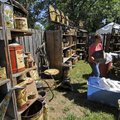 CLOTHESLINE FAIR - Lashay Swem of Neosho, Mo., sets up her hand-painted goodies Friday while prepari...