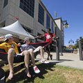 HOG HAMMOCK - Scott Rogers, left, and Joey Aldrich sit in a hammock Friday while visiting with Cody ...