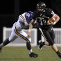 Bentonville sophomore Garrett Kaufman breaks a tackle against North Little Rock on Sept. 3 in Benton...