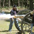BLAST FROM PAST - Park rangers in Union uniforms shield their ears Saturday from the blast of a 6-po...