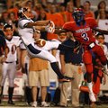 Rogers Heritage defensive back Colin Roberts strips a pass intended for Helena wide receiver Scott H...