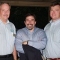Youth Bridge Executive Director Scott Linebaugh, from left, board member West Doss and John Threet g...
