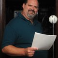 Keith Lyons, a voice performer from Siloam Springs, poses for a photograph in his home in Siloam Spr...