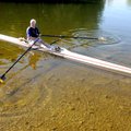 Bill Correll brings his 26-foot-long rowing shell Jada Rose into the shallows Sunday near his dock o...