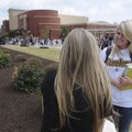 Sara Symons, 16, right, talks with Samantha Wallace, 16, as students change classes Sept. 2 at Bento...