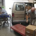 Grant Brand loads frozen food Friday for Westridge Free Will Baptist Church of Fayetteville as Shirl...