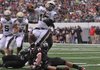 Shiloh Christian quarterback Kiehl Frazier goes over a pair of Euless (Texas) Trinity defenders for a touchdown during the third quarter of Monday’s game in the Kirk Herbstreit National Kickoff Classic at Cowboys Stadium in Arlington, Texas.