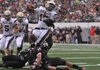 Shiloh Christian quaterback Kiehl Frazier jumps over defenders from Euless Trinity (Texas) for a touchdown during the third quarter of Monday’s game in the Kirk Herbstreit National Kickoff Classic in Cowboys Stadium in Arlington, Texas.