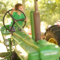 TRACTOR TYKE - Will Trotter-Wright, 4, of Fayetteville plays on a 1946 John Deere B tractor on displ...