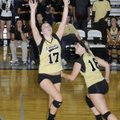Bentonville’s Rebecca Brown sets the ball against Springdale Har-Ber on Tuesday in Springdale.