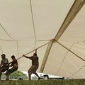 Larry Driver, left, Nick Riggins and brother Whitney Riggins, all employees of AAA Tents for Events ...
