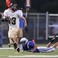 Bentonville Gold’s Payton Fitch runs for an 82-yard touchdown in the first half against Rogers High ...