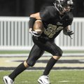 Bentonville Black’s Clay Wallace returns a kickoff Sept. 9 against Rogers Heritage in Bentonville.