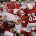 Springdale George’s Josiah Wymer gets taken down by a host of Ramay defenders Thursday.
