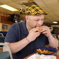 Nelson dives into the Inferno Burger.
