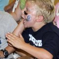 Jaden Tadda, Dallas Cowboys fan and Cooper Elementary School third-grader, cheers Friday in Bella Vi...