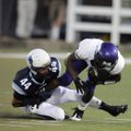 Springdale Har-Ber senior Hunter Kissinger tackles El Dorado senior John Miles for a loss during the...