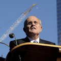FILE — Former New York  City Mayor Rudy Giuliani reads a poem during a memorial service commemoratin...
