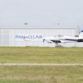  An airplane rolls past the empty Pinnacle Air Executive Jet Service hanger at the Springdale Airpor...