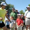 Fans watch Yani Tseng leave the 8th tee Sunday during the final day of the P&G NW Arkansas Champions...