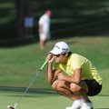 Yani Tseng lines up a putt on the 18th green Sunday during the final day of the P&G NW Arkansas Cham...