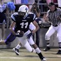 Springdale Har-Ber junior wide receiver Michael Fine carries the ball against El Dorado in the first...