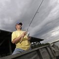 Whitney Emmius of Tontitown fishes Monday for blue gill, red ears and crappie at Lake Fayetteville. ...