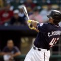 Northwest Arkansas’ Clint Robinson hits a three-run double in the first inning Monday against Spring...