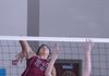 Siloam Springs’ Lizzy Briones spikes the ball against Springdale Har-Ber’s Kelli Toomer on Monday in a match at Har-Ber High.