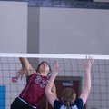 Siloam Springs’ Lizzy Briones spikes the ball against Springdale Har-Ber’s Kelli Toomer on Monday in...