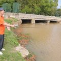 Lawrence Haney casts his lure Tuesday into a newly filled Lake Bella Vista near the dam in Bentonvil...