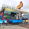 A customer places an order Monday at El Ultima Taco on Emma Avenue in Springdale. People of many eth...