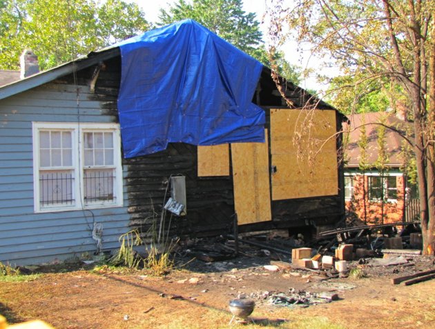 boards-and-a-tarp-help-cover-damage-to-a-hillcrest-home-damaged-in-a-fire-early-wednesday-morning