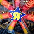 FILE - In this June 6, 2005 file photo, customers shop and ride the ferris wheel at Toys "R" Us in N...