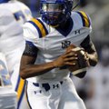 North Little Rock quarterback Kaylon Cooper rolls out of the pocket Sept. 3 during the Charging Wild...